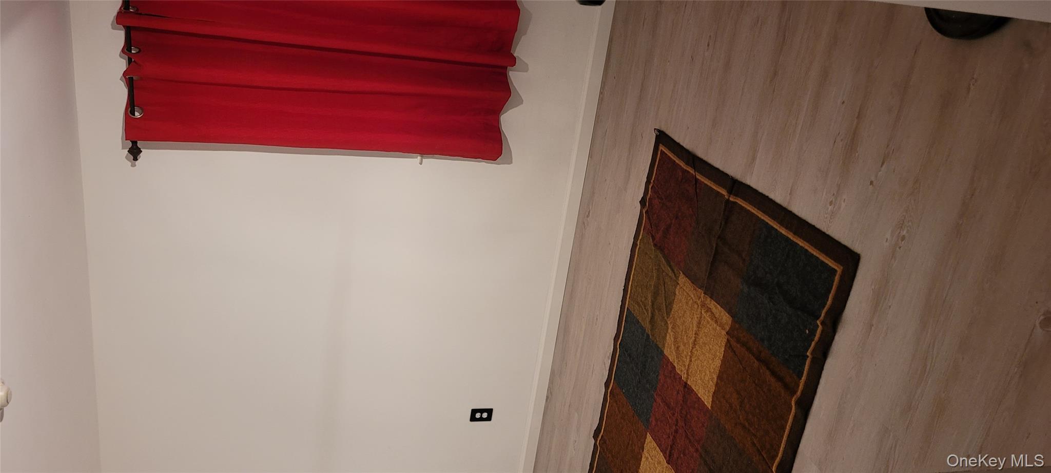 2 Williamsburg Court, Unit C Ridge, NY 11961 - Photo 13 of 20 Spare room with wood finished floors and baseboards