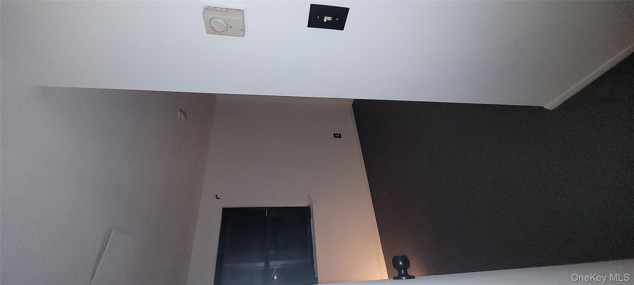 2 Williamsburg Court, Unit C Ridge, NY 11961 - Photo 17 of 20 Unfurnished room with dark colored carpet