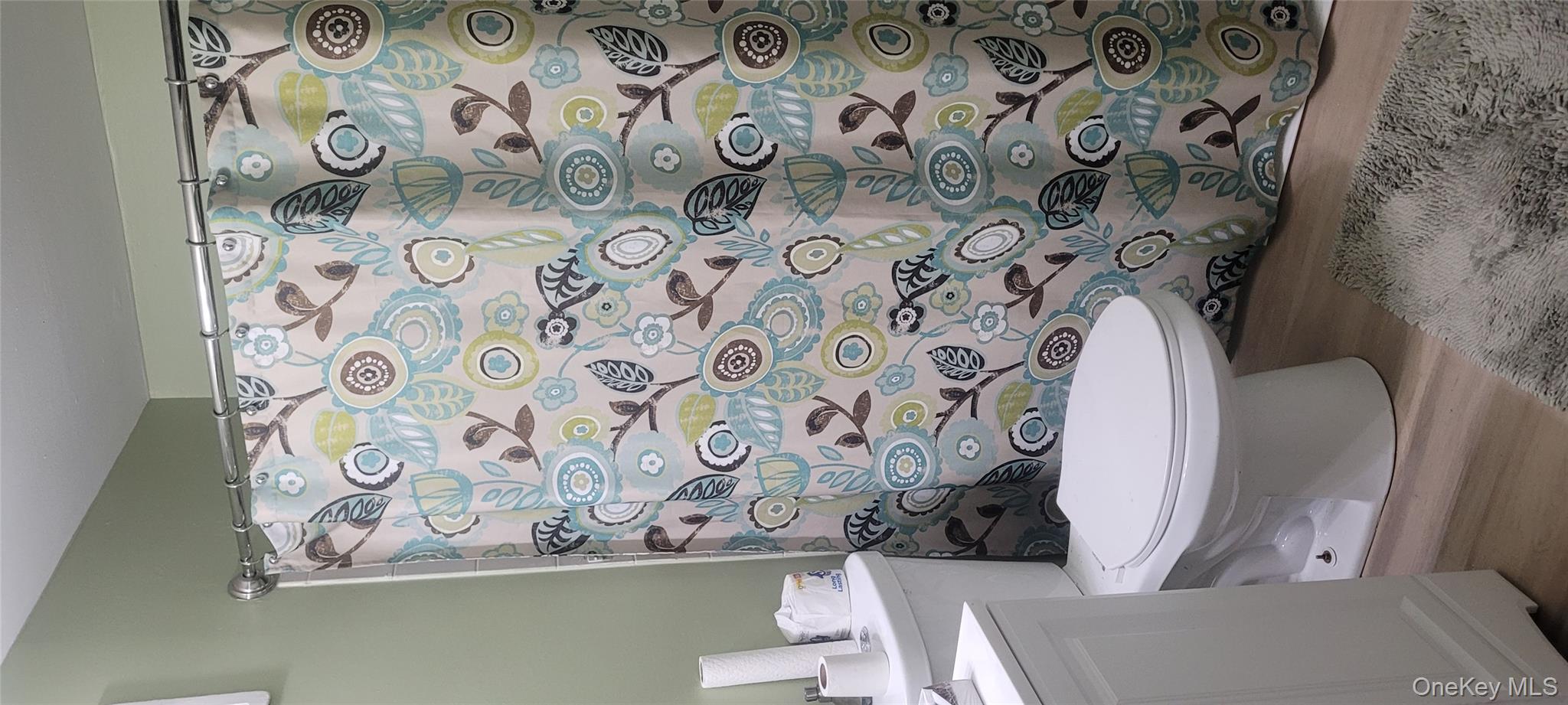 2 Williamsburg Court, Unit C Ridge, NY 11961 - Photo 5 of 20 Full bathroom featuring wood finished floors, a shower with curtain, and vanity