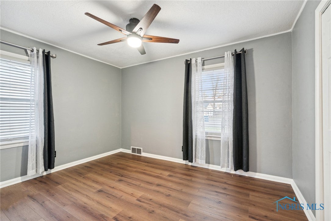 1021 Rochelle Road Toledo, OH 43615 - Photo 21 of 47 Bedroom 1, vinyl floors and ceiling fan.