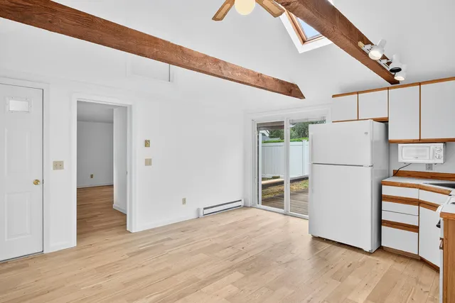 a kitchen with a refrigerator a stove and a sink