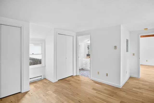 a view of a livingroom with wooden floor