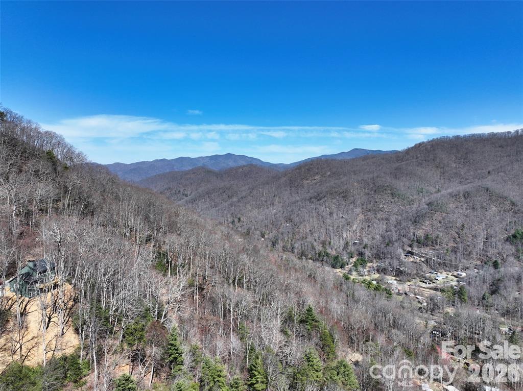 99999 Green Ridge Falls Road, Unit 17 Barnardsville, NC 28709 - Photo 13 of 15 a view of a mountain range with trees in the background