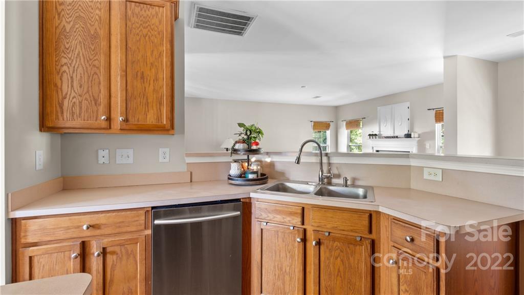 6123 Morning Mist End Fort Mill, SC 29708 - Photo 21 of 46 a kitchen with stainless steel appliances granite countertop a sink stove and cabinets