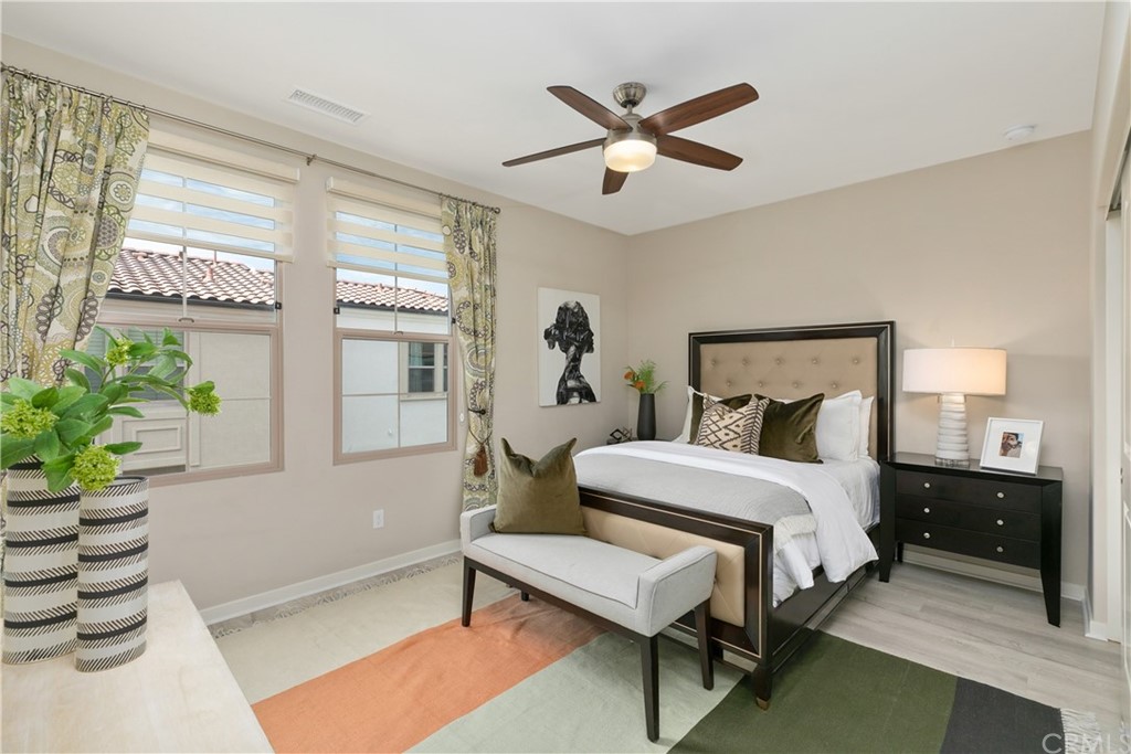 144 Briarberry Irvine, CA 92618 - Photo 26 of 44 a bedroom with a bed and a potted plant