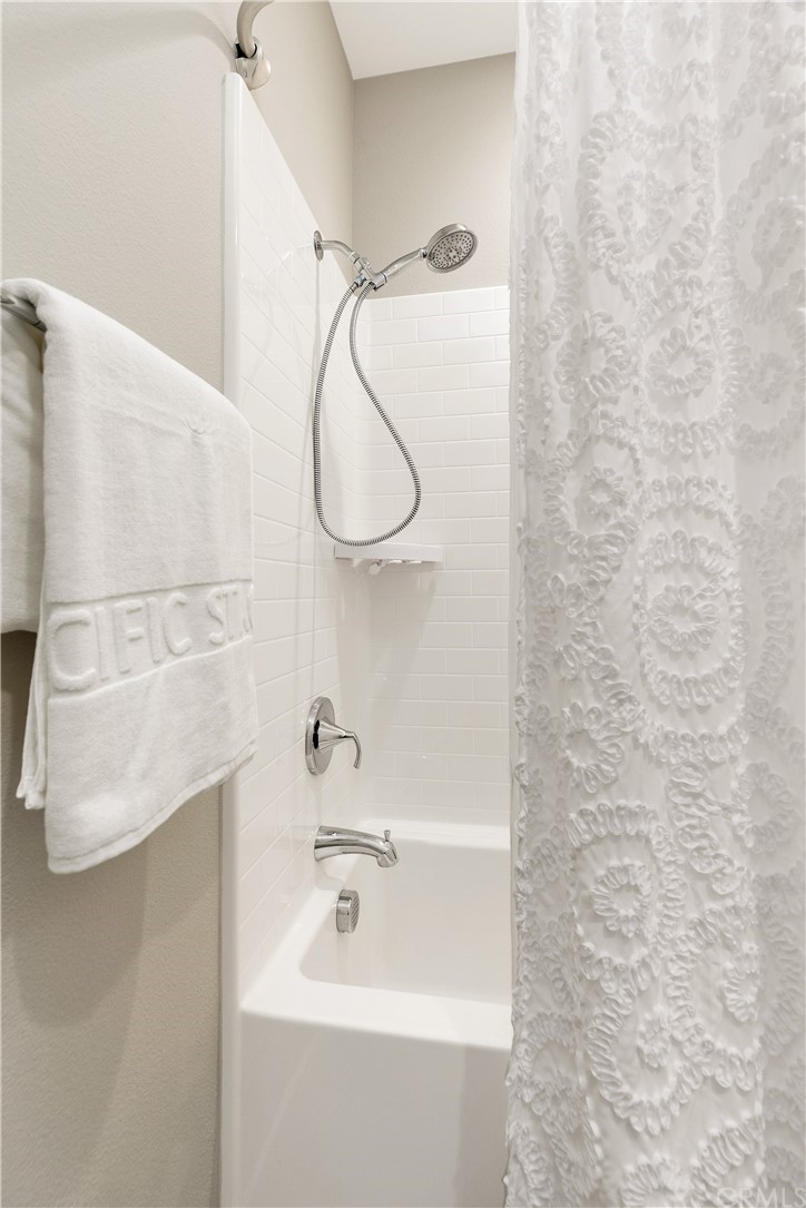 144 Briarberry Irvine, CA 92618 - Photo 31 of 44 a bathroom with a sink a mirror and a shower