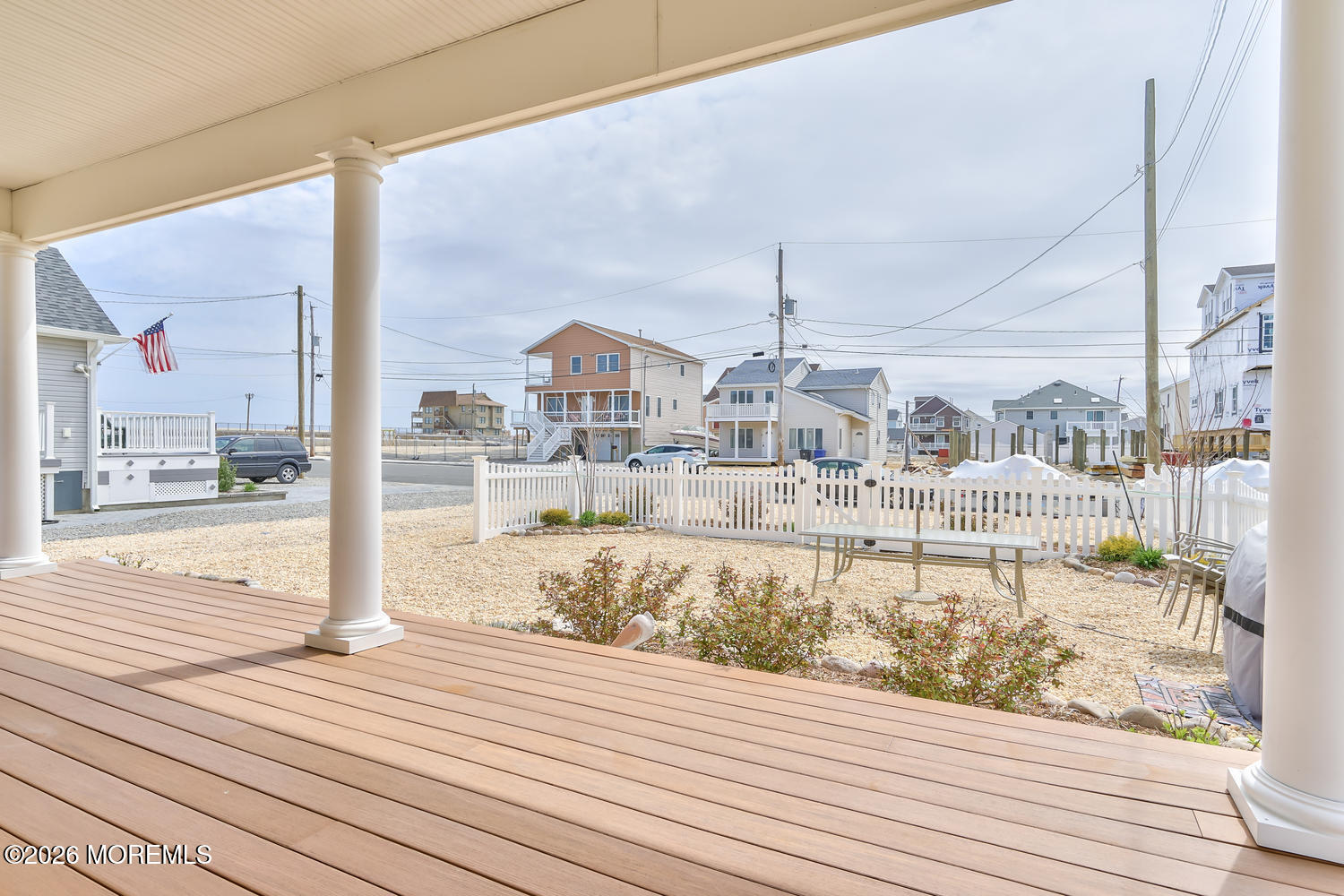 10 4th Avenue, Unit 101 Seaside Heights, NJ 08751 - Photo 11 of 20 a view of a balcony with wooden floor