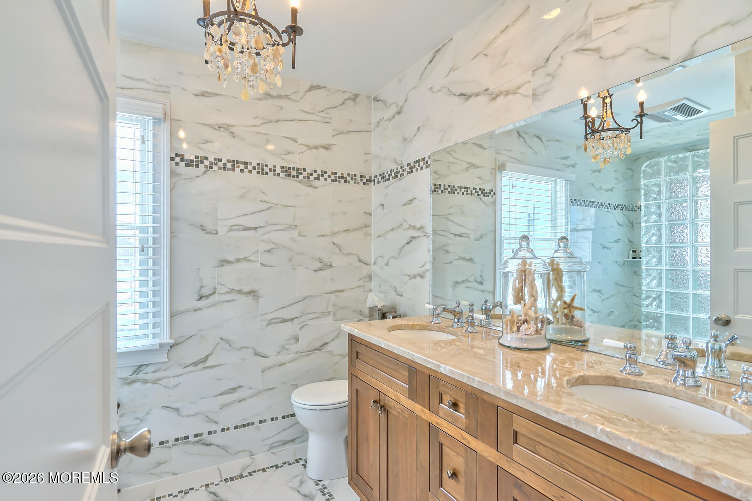 10 4th Avenue, Unit 101 Seaside Heights, NJ 08751 - Photo 12 of 20 a bathroom with a sink a toilet and shower