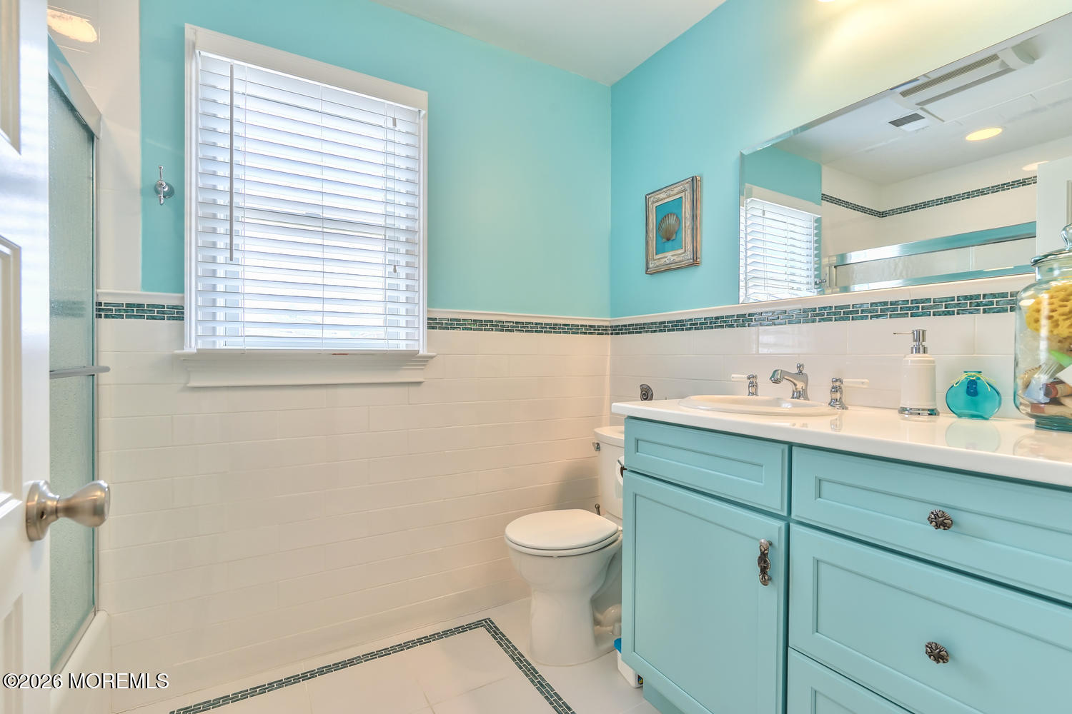 10 4th Avenue, Unit 101 Seaside Heights, NJ 08751 - Photo 15 of 20 a bathroom with a sink a toilet and a window