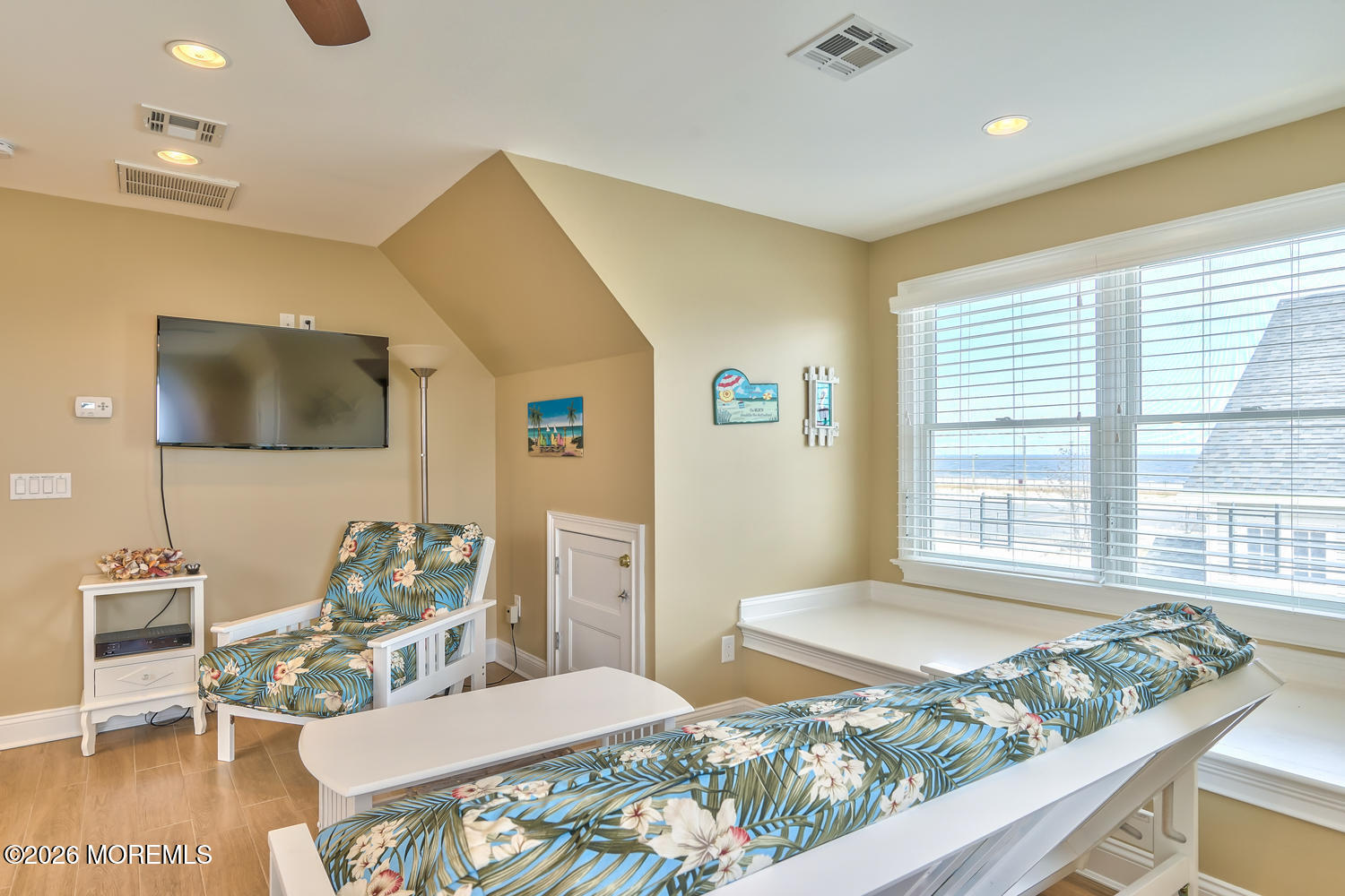 10 4th Avenue, Unit 101 Seaside Heights, NJ 08751 - Photo 16 of 20 a bedroom with a bed and a flat screen tv