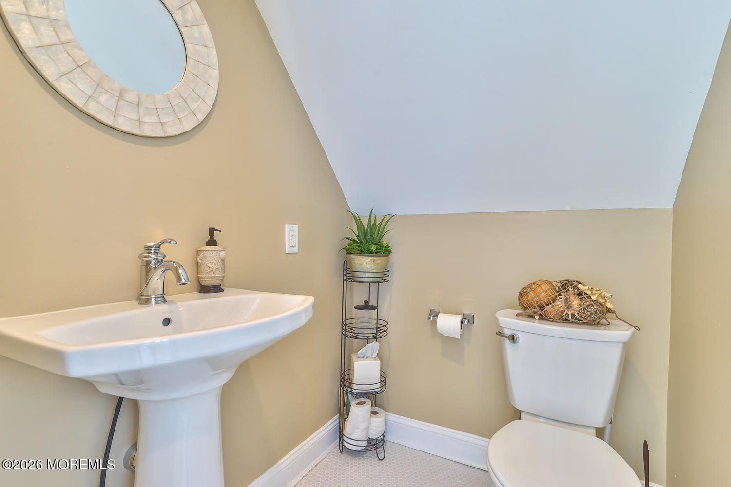 10 4th Avenue, Unit 101 Seaside Heights, NJ 08751 - Photo 20 of 20 a bathroom with a toilet a sink and a mirror
