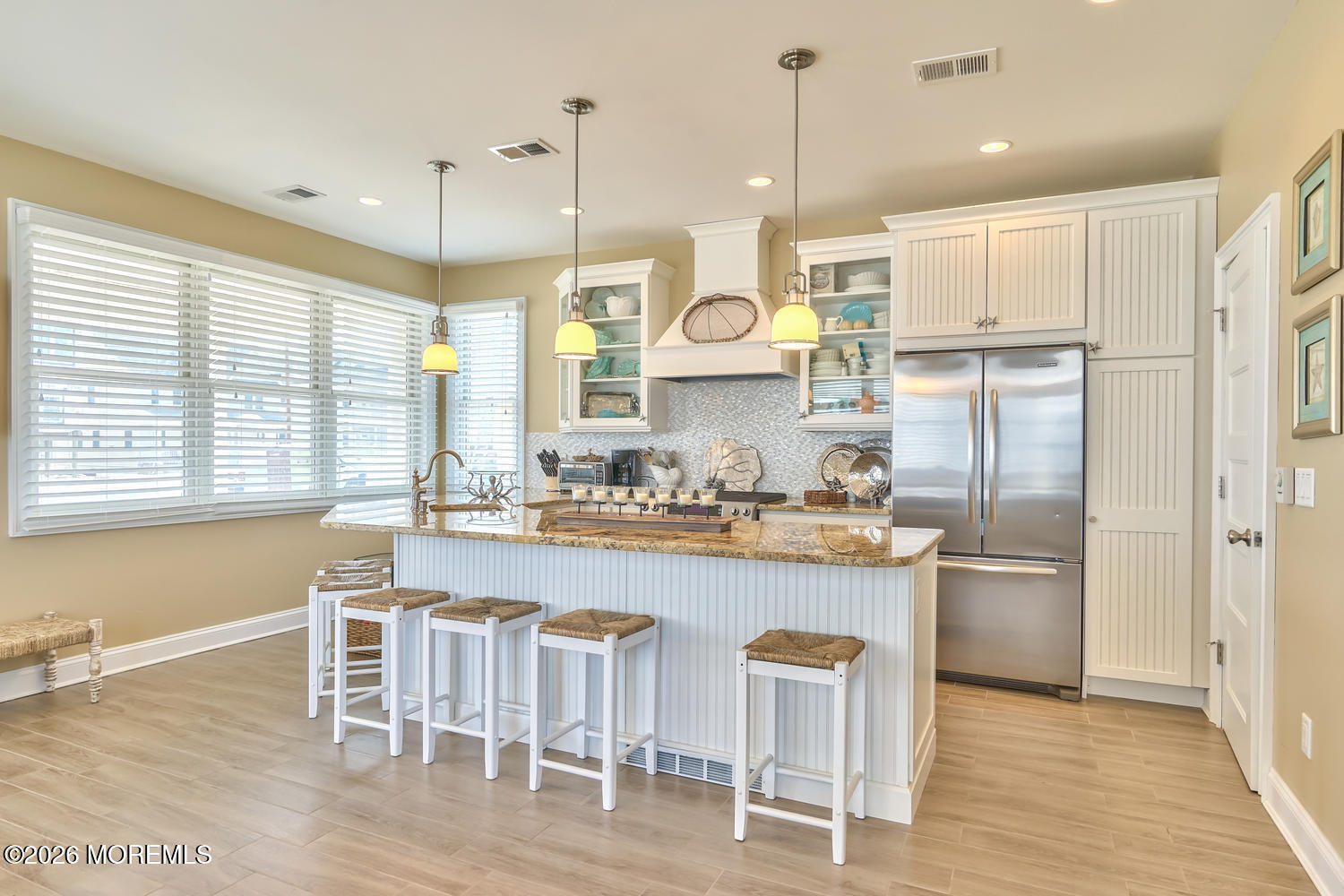 10 4th Avenue, Unit 101 Seaside Heights, NJ 08751 - Photo 2 of 20 a large kitchen with a table and chairs