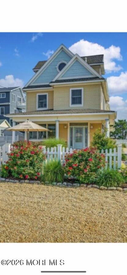 10 4th Avenue, Unit 101 Seaside Heights, NJ 08751 - Photo 4 of 20 a black and white house with a yard