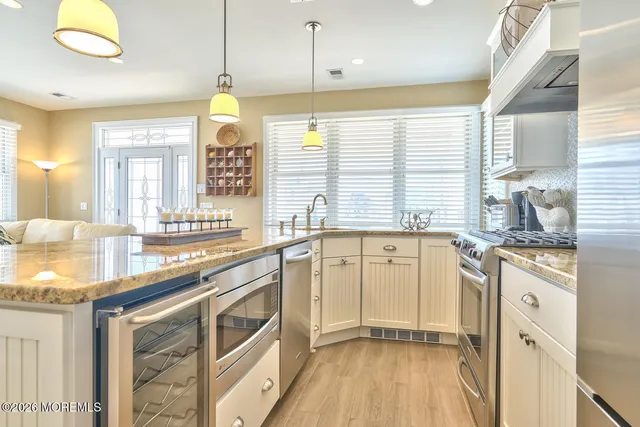 a living room with furniture and flat screen tv