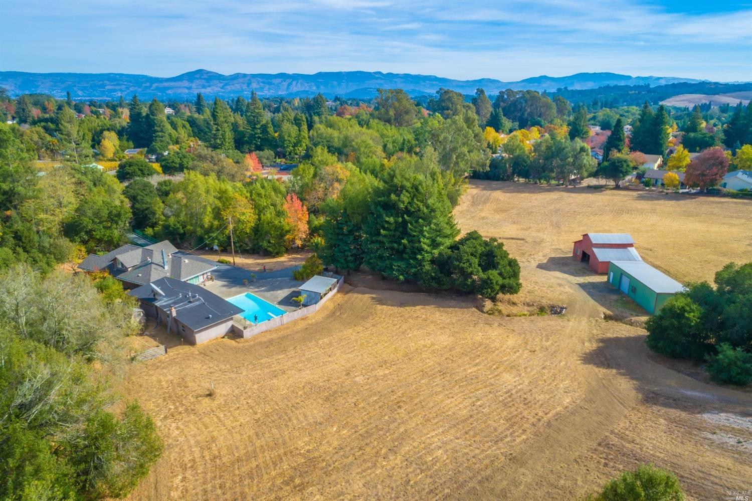 an aerial view of a house with a garden