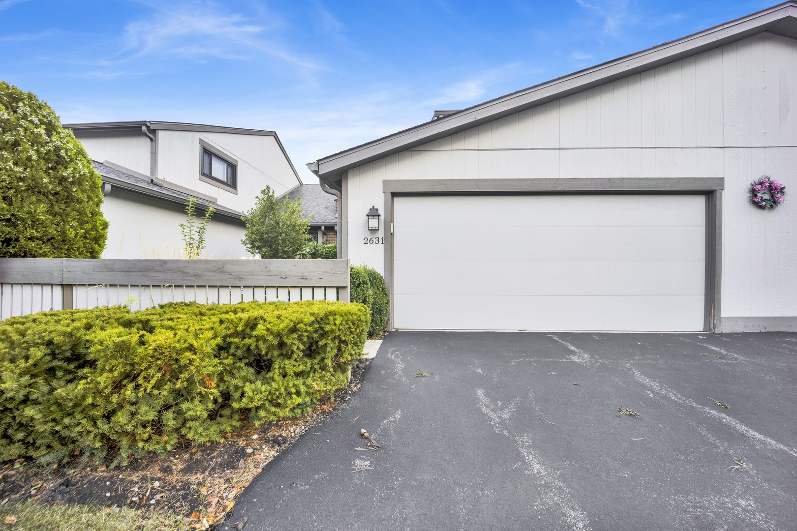 a view of a house with a street
