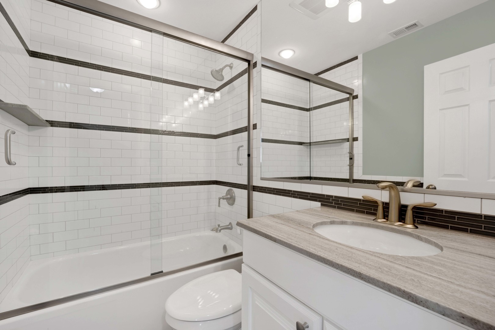 2631 Smith Street Rolling Meadows, IL 60008 - Photo 17 of 24 a bathroom with a granite countertop sink and a mirror