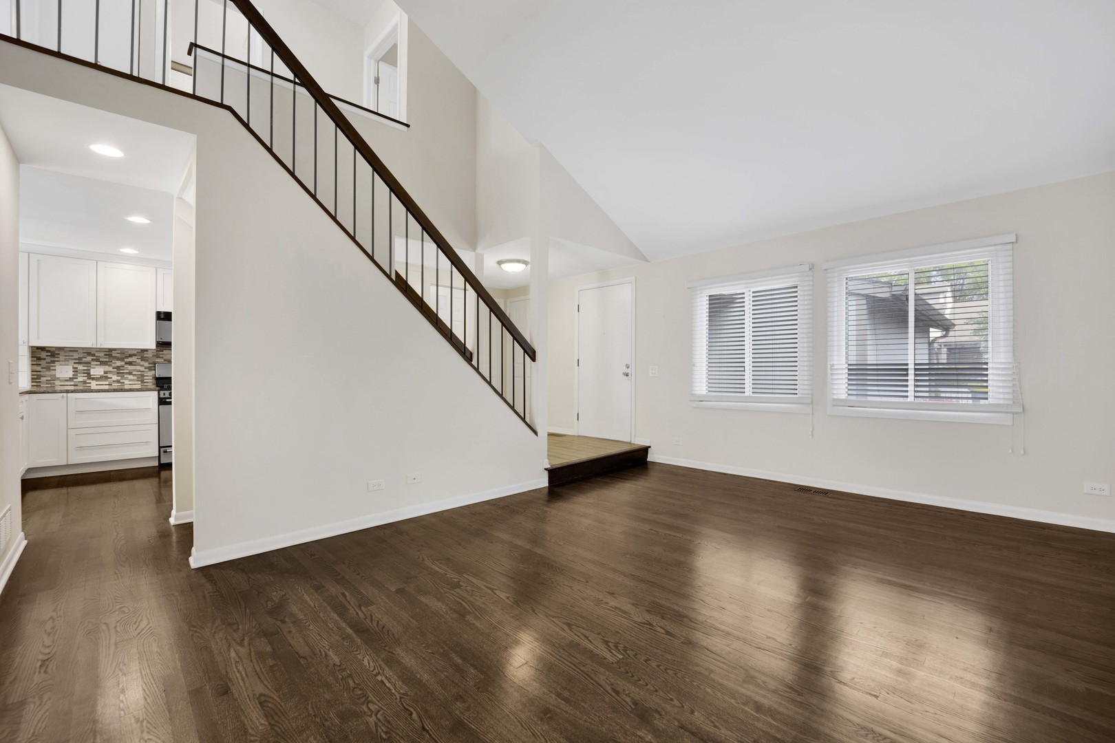 2631 Smith Street Rolling Meadows, IL 60008 - Photo 4 of 24 a view of an entryway with wooden floor and stairs