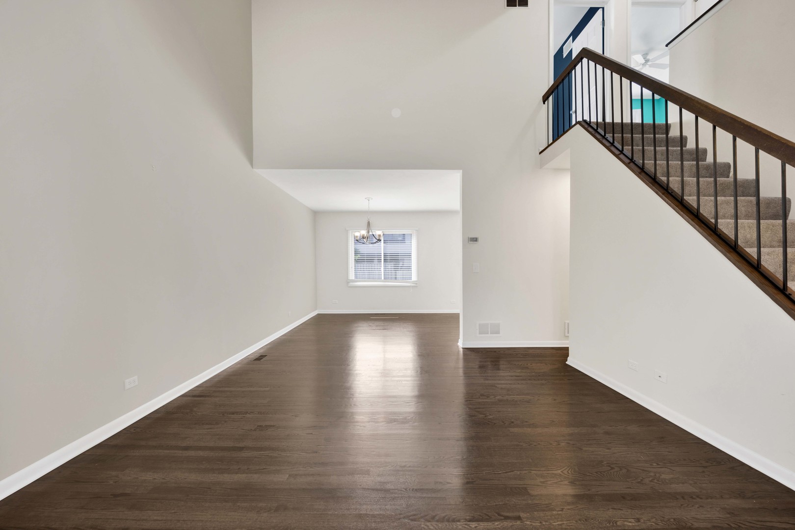2631 Smith Street Rolling Meadows, IL 60008 - Photo 5 of 24 a view of an empty room with wooden floor and a window