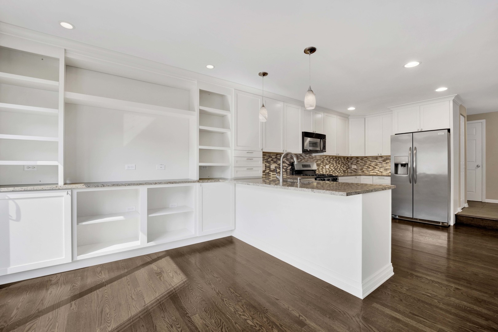 2631 Smith Street Rolling Meadows, IL 60008 - Photo 7 of 24 a kitchen with stainless steel appliances granite countertop a refrigerator and a stove top oven
