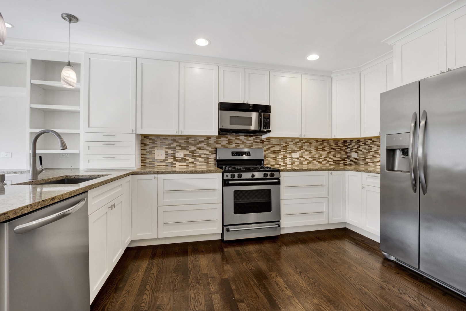 2631 Smith Street Rolling Meadows, IL 60008 - Photo 9 of 24 a kitchen with granite countertop a refrigerator stove and sink