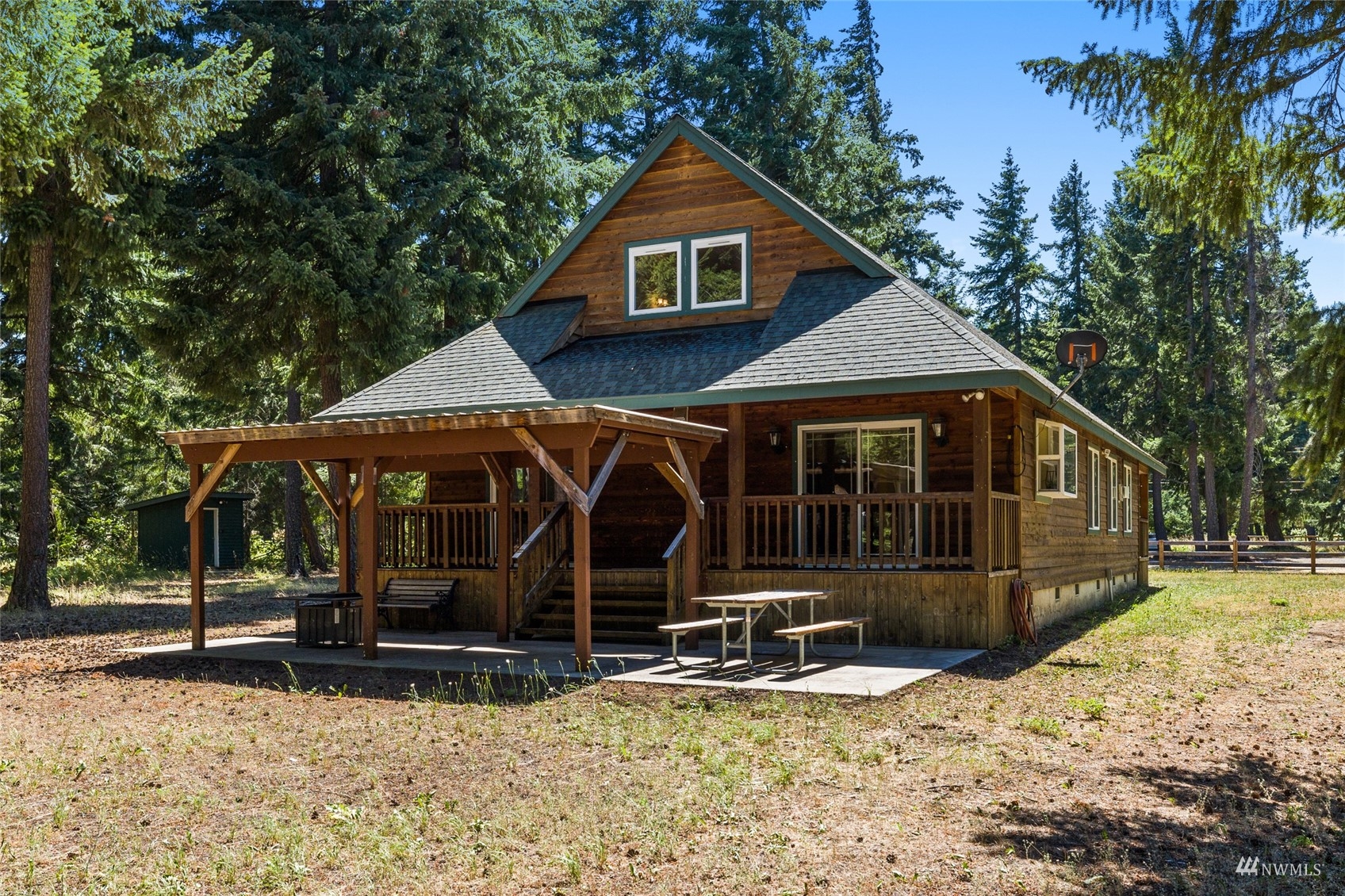 5711 Nelson Siding Road Cle Elum, WA 98922 - Photo 12 of 40 a view of a house with a yard covered in snow