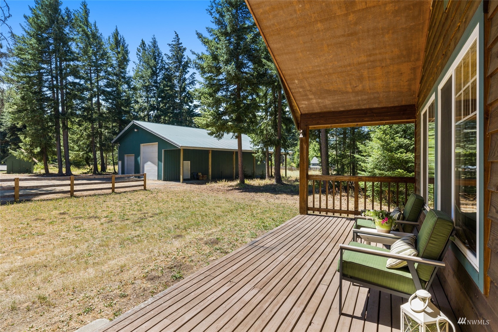 5711 Nelson Siding Road Cle Elum, WA 98922 - Photo 15 of 40 a view of a house with backyard and deck