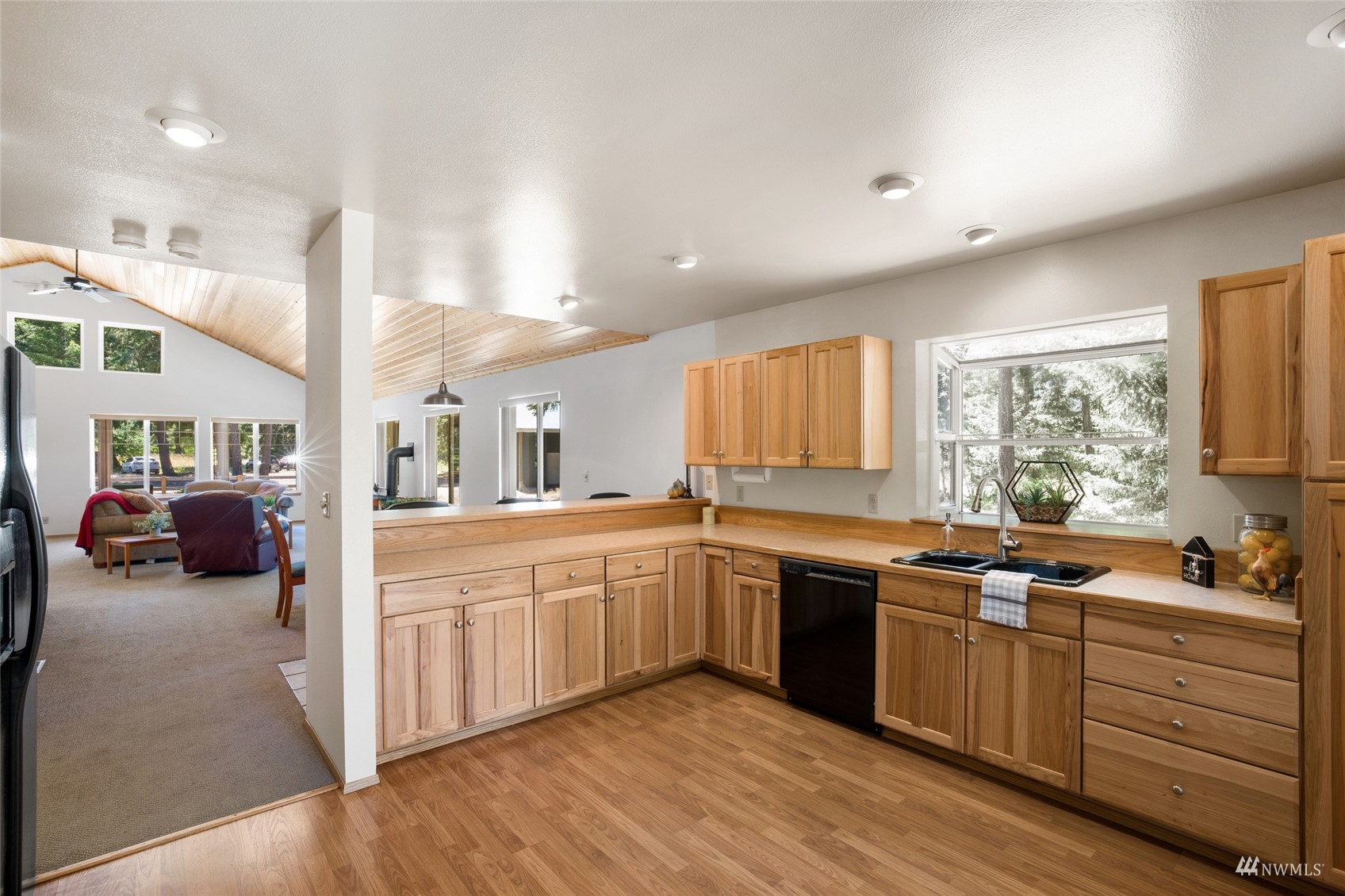 5711 Nelson Siding Road Cle Elum, WA 98922 - Photo 24 of 40 a large kitchen with stainless steel appliances granite countertop a sink and dishwasher a stove with wooden floor