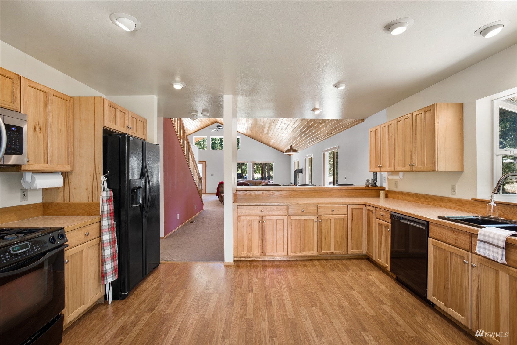 5711 Nelson Siding Road Cle Elum, WA 98922 - Photo 26 of 40 a kitchen with stainless steel appliances granite countertop a refrigerator a stove top oven and sink