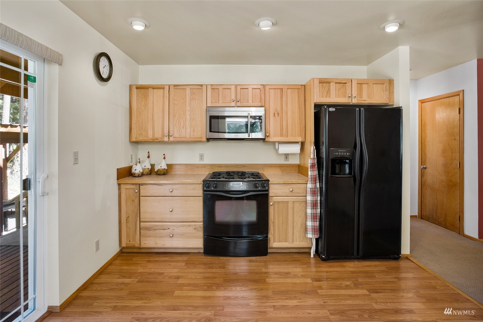 5711 Nelson Siding Road Cle Elum, WA 98922 - Photo 27 of 40 a kitchen with stainless steel appliances a refrigerator and a stove top oven