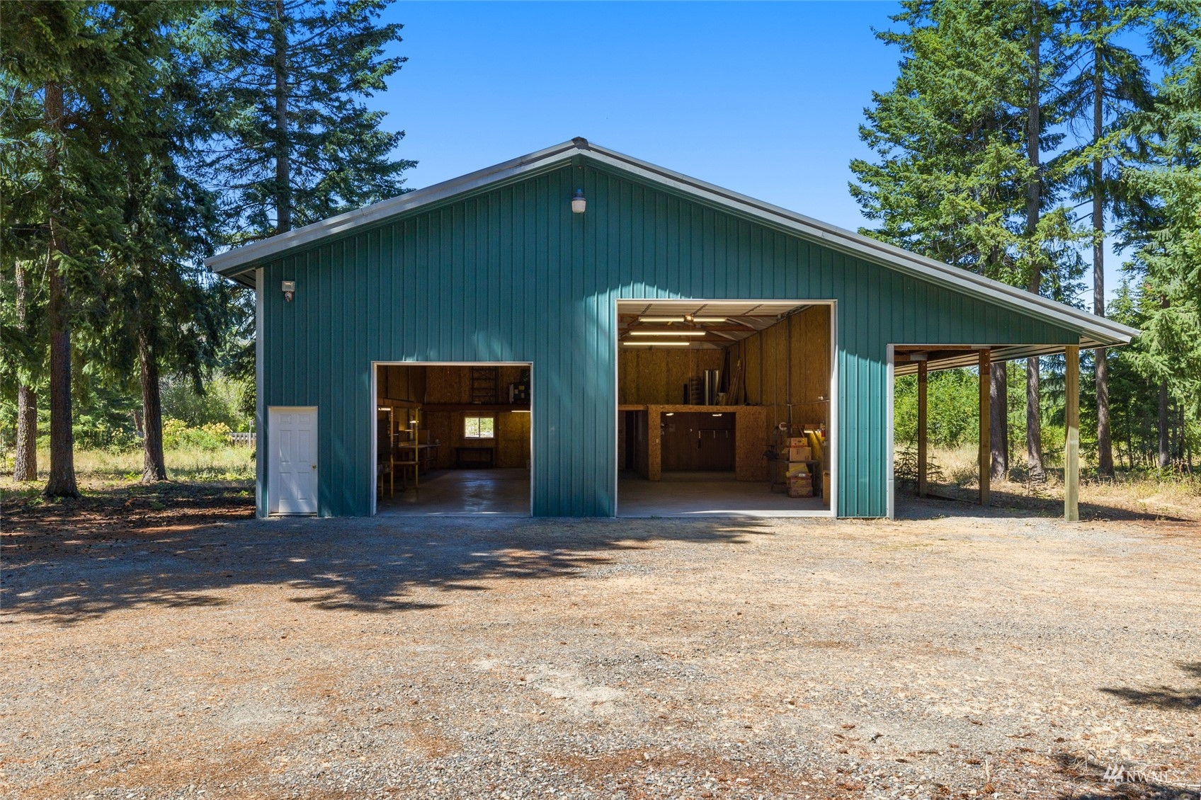 5711 Nelson Siding Road Cle Elum, WA 98922 - Photo 6 of 40 a front view of a house with a yard and garage