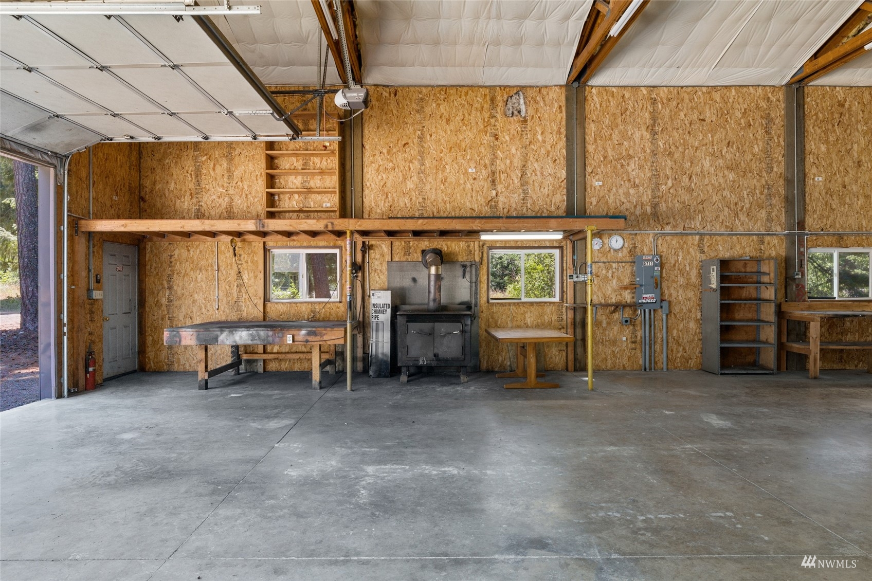 5711 Nelson Siding Road Cle Elum, WA 98922 - Photo 9 of 40 a view of a room with racks on the wall