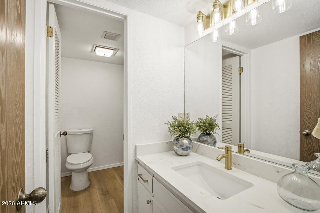 165 Verde Valley School Road, Unit 6 Sedona, AZ 86351 - Photo 21 of 40 a bathroom with a toilet a sink and a mirror