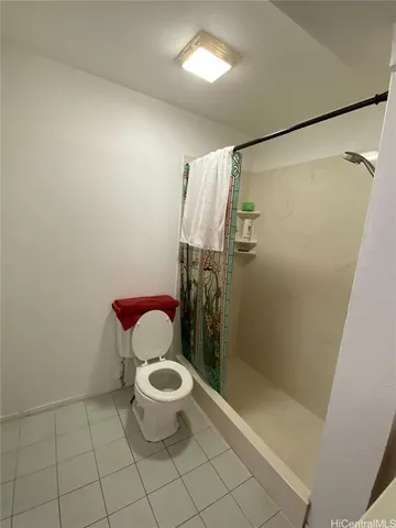 a bathroom with a toilet a sink and bathtub