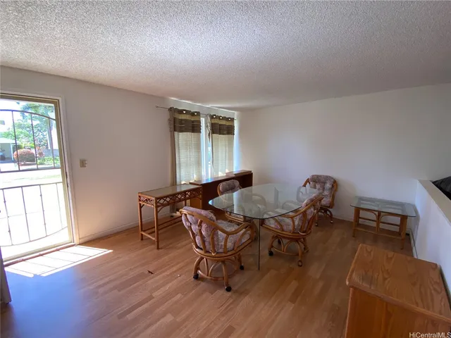 a kitchen with refrigerator and microwave