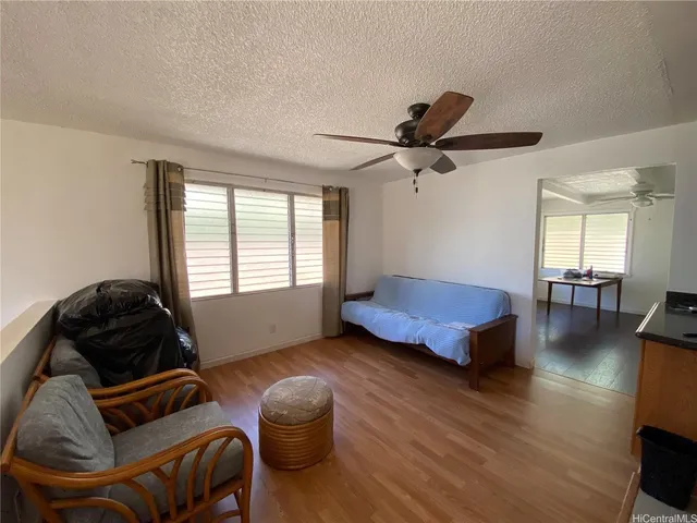 a room with wooden floor and window