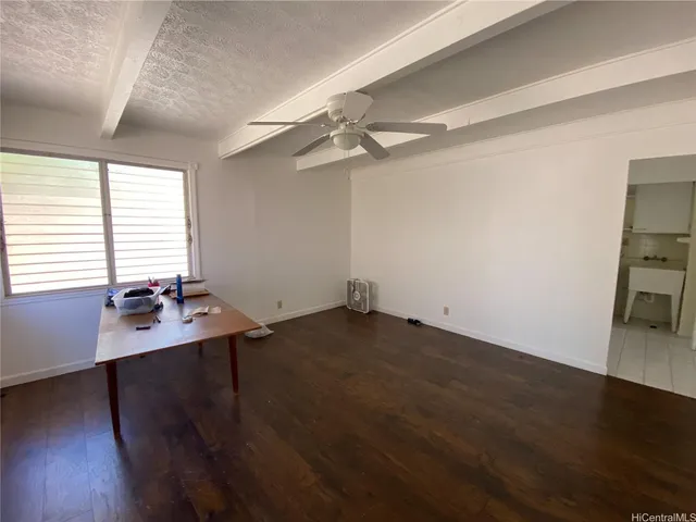 a view of room with window and ceiling fan