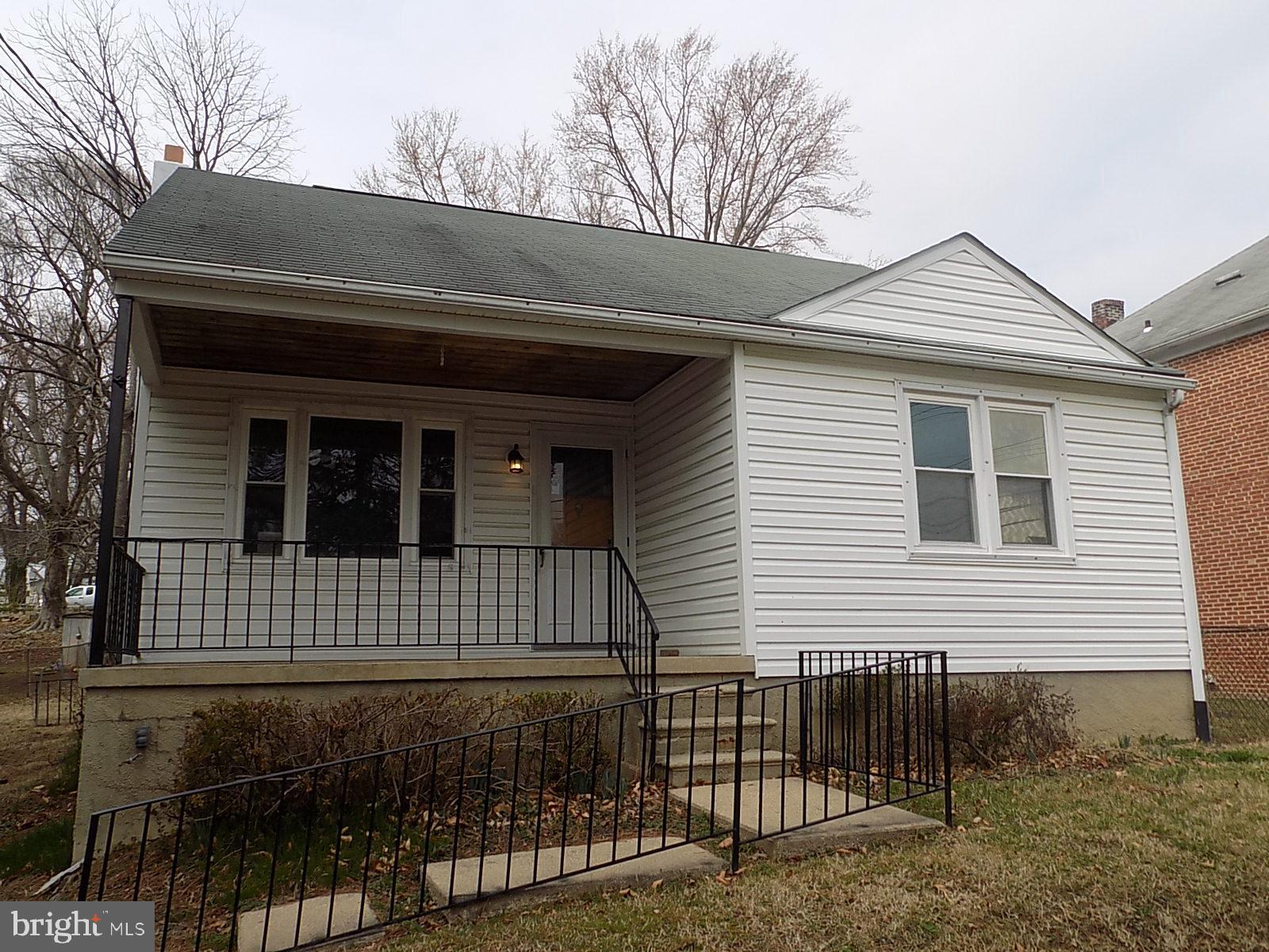 9902 Harford Road Baltimore, MD 21234 - Photo 1 of 13 a view of front of a house with wooden fence