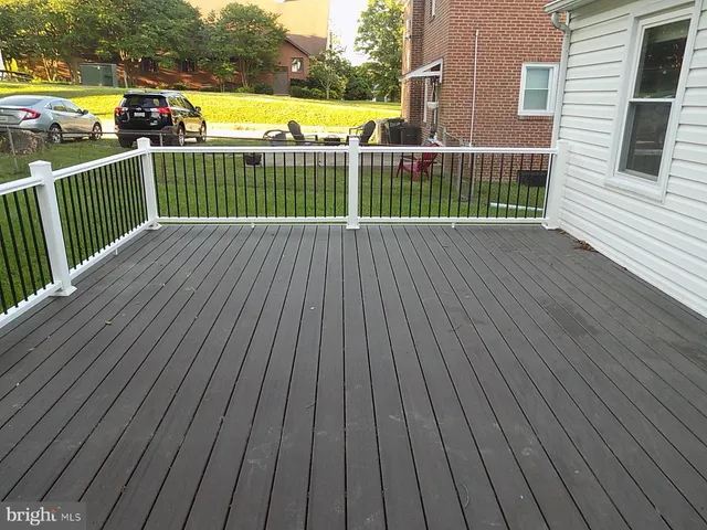 a view of balcony with wooden floor