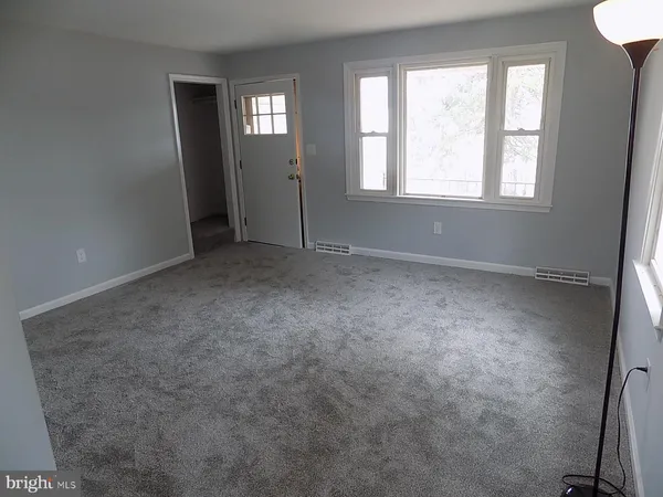 an empty room with windows