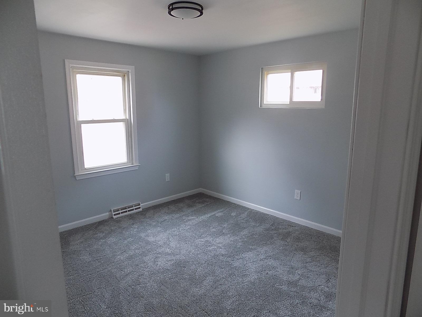 9902 Harford Road Baltimore, MD 21234 - Photo 9 of 13 an empty room with a window