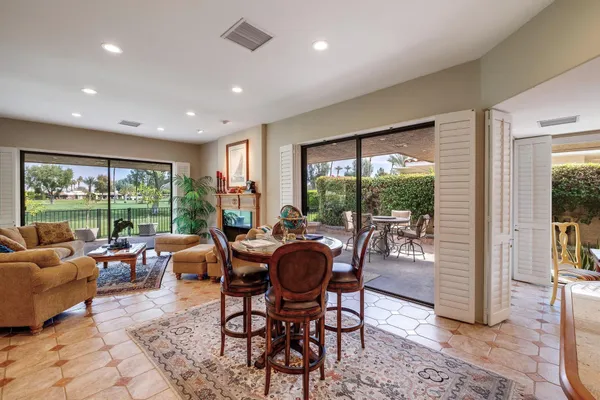 a view of a dining room with furniture window and outside view