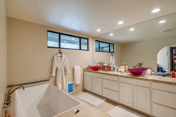 a view of a kitchen with sink and microwave