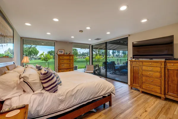 a bed room with a bed and dresser