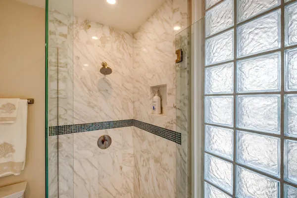 a bathroom with a tub and a shower