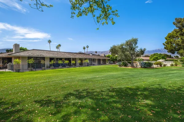 a view of an house with a big yard