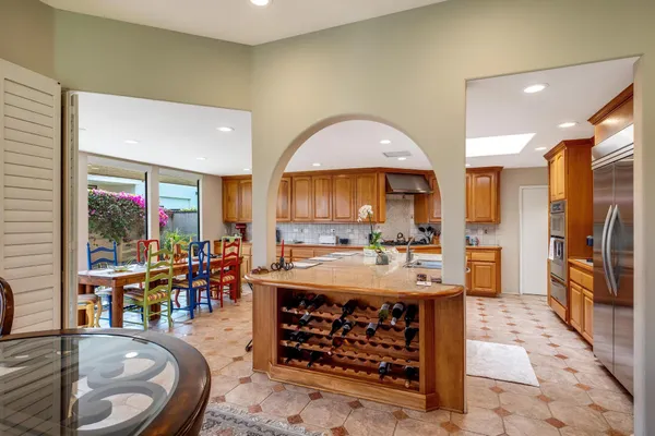 a large kitchen with lots of counter space and furniture