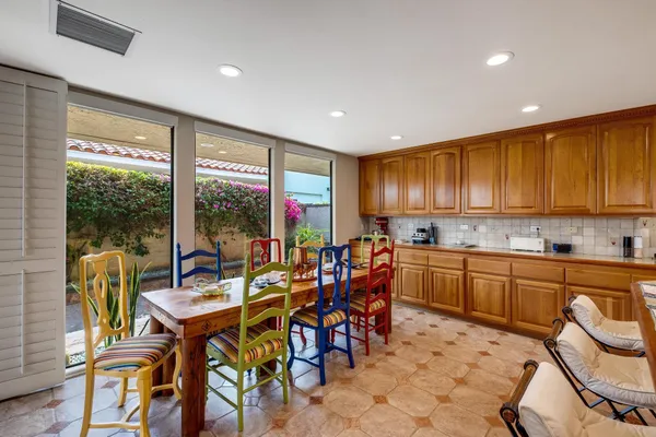 a view of a dining room with furniture window and outside view