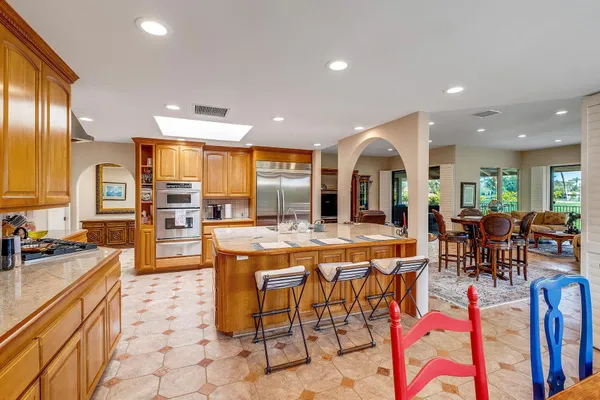 a large kitchen with lots of furniture and appliances
