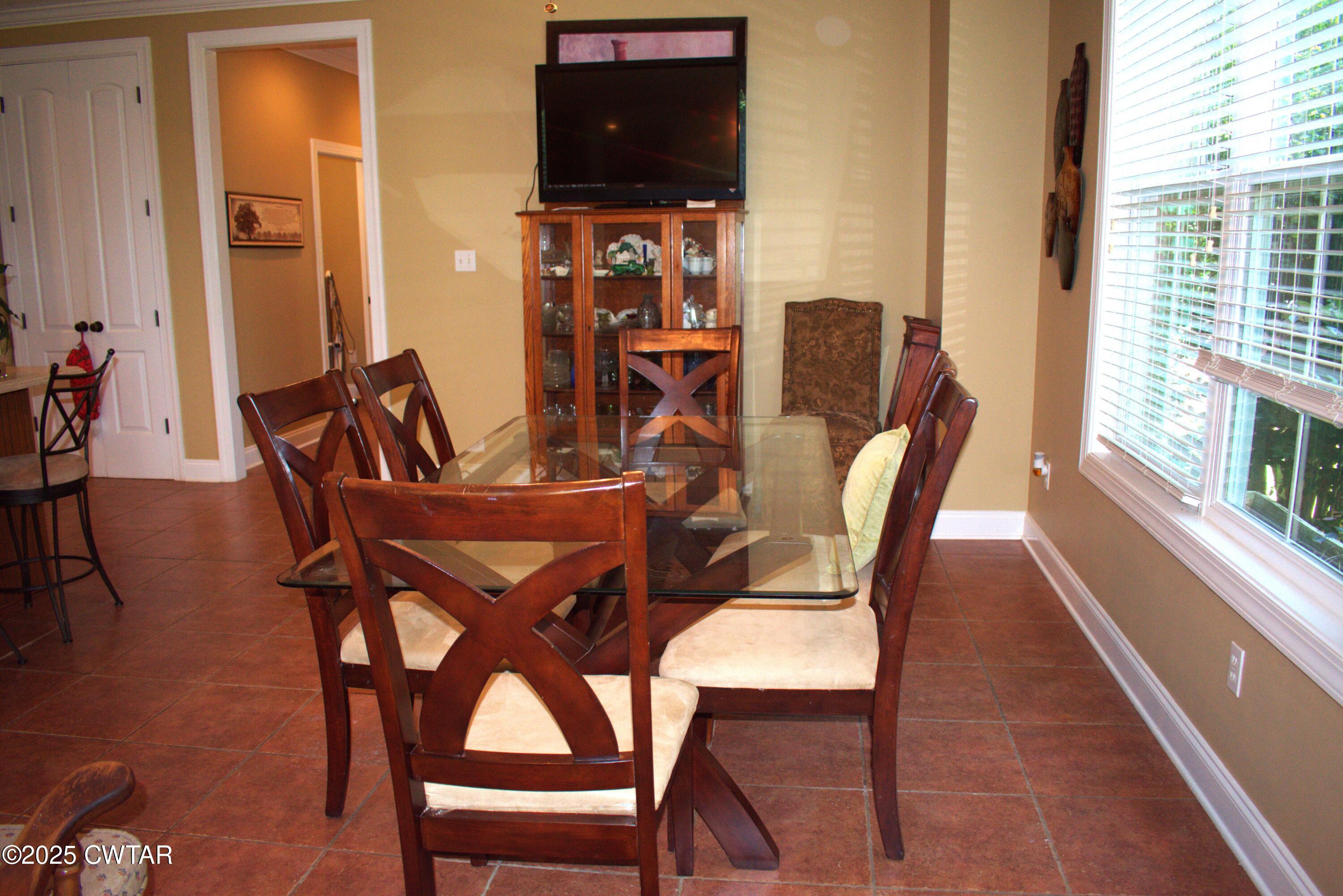 715 Roundtree Lane Beech Bluff, TN 38313 - Photo 14 of 24 a view of a dining room with furniture and wooden floor